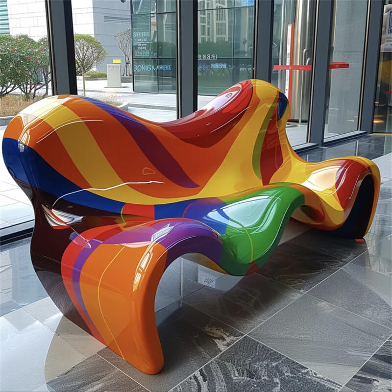 Multicolor wave-shaped fiberglass bench with glossy finish for indoor public art seating