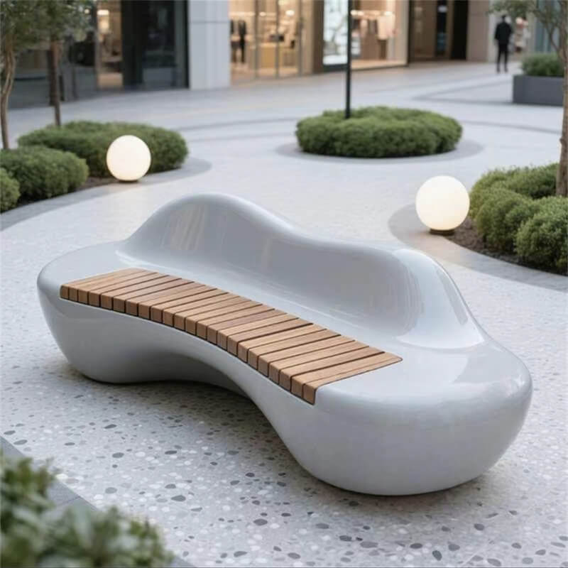 Wavy‑shaped fiberglass bench with wooden slat seats, a modern outdoor public leisure seat