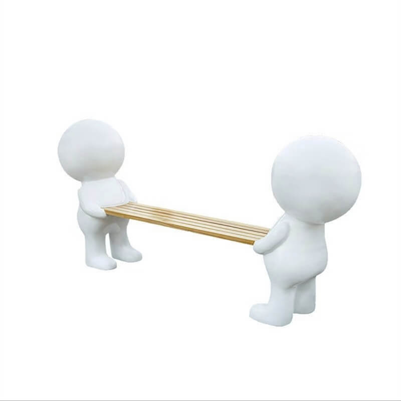 Two characters carrying a board‑shaped FRP bench with white cartoon figures and a natural wood seat, a versatile creative rest seat for indoor and outdoor use