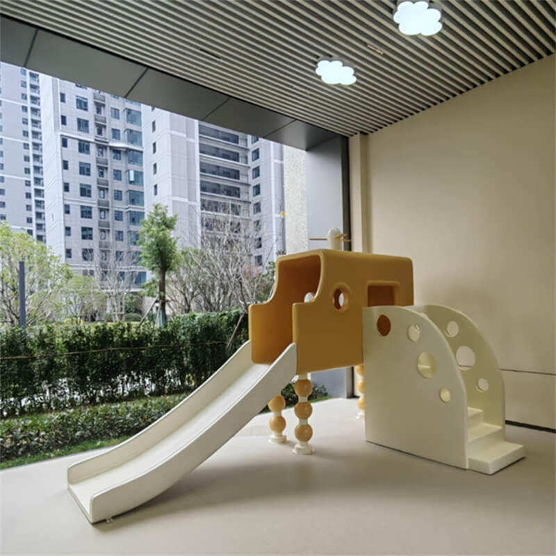 Multi-angle real photo of a yellow-white airplane-shaped FRP slide with a smooth surface, kids play equipment for kindergarten indoor areas