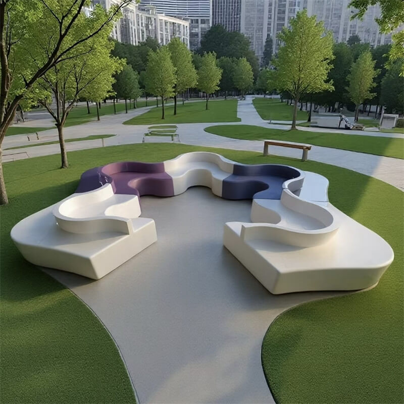 Multi-color flower-shaped fiberglass outdoor bench set in an urban park
