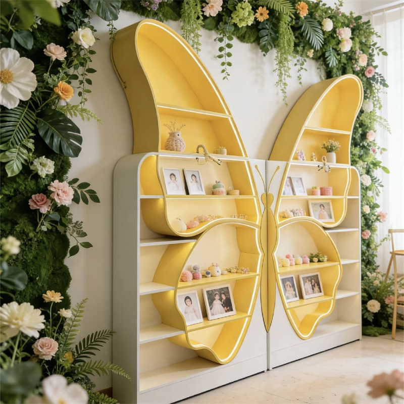 butterfly display stand used in a photo studio, comes with a plant background, shows photos and shooting props