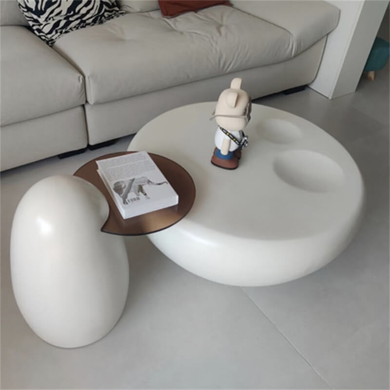 Viral‑style paw‑shaped fiberglass coffee table set with an indented round top in a modern indoor leisure zone