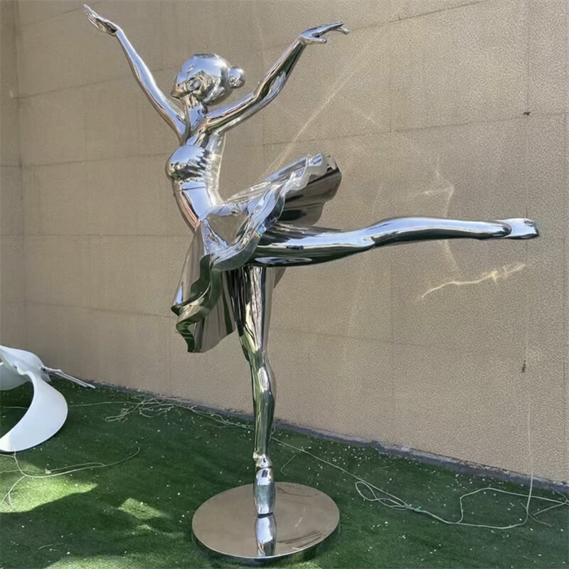 Flowing mirror stainless steel ballerina sculpture in extended leg dance pose