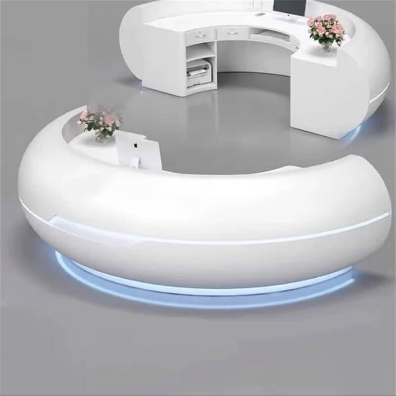 Two white curved fiberglass reception desks with bottom LED lights side by side. A minimalist modern design comparison.