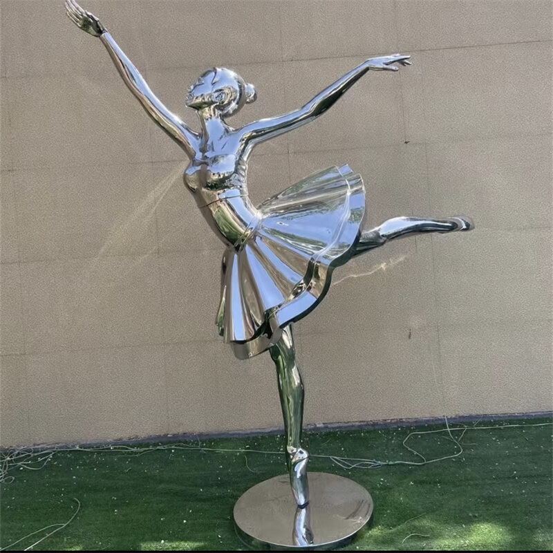 Close-up of stainless steel ballerina sculpture, showing mirror polish details