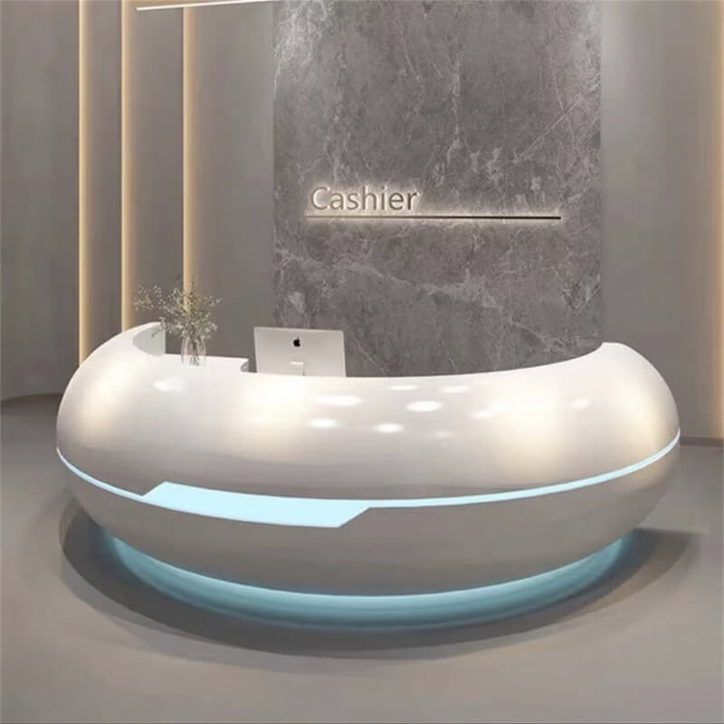 Close-up of a white curved fiberglass reception desk with built-in LED light strips against a marble background wall.