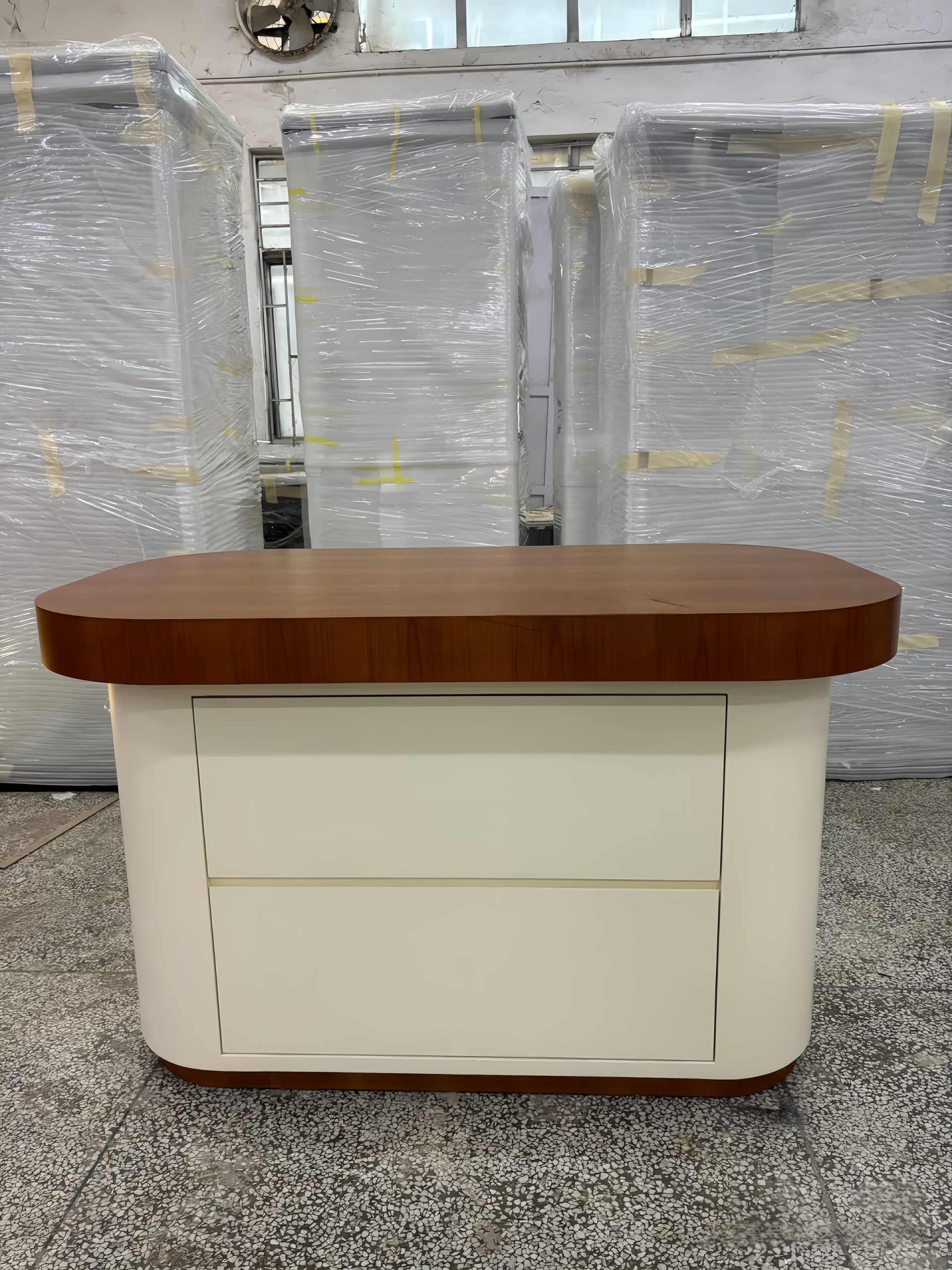 Factory finished walnut‑top rounded jewelry island counter, cream white cabinet with double drawers, modern retail display cabinet