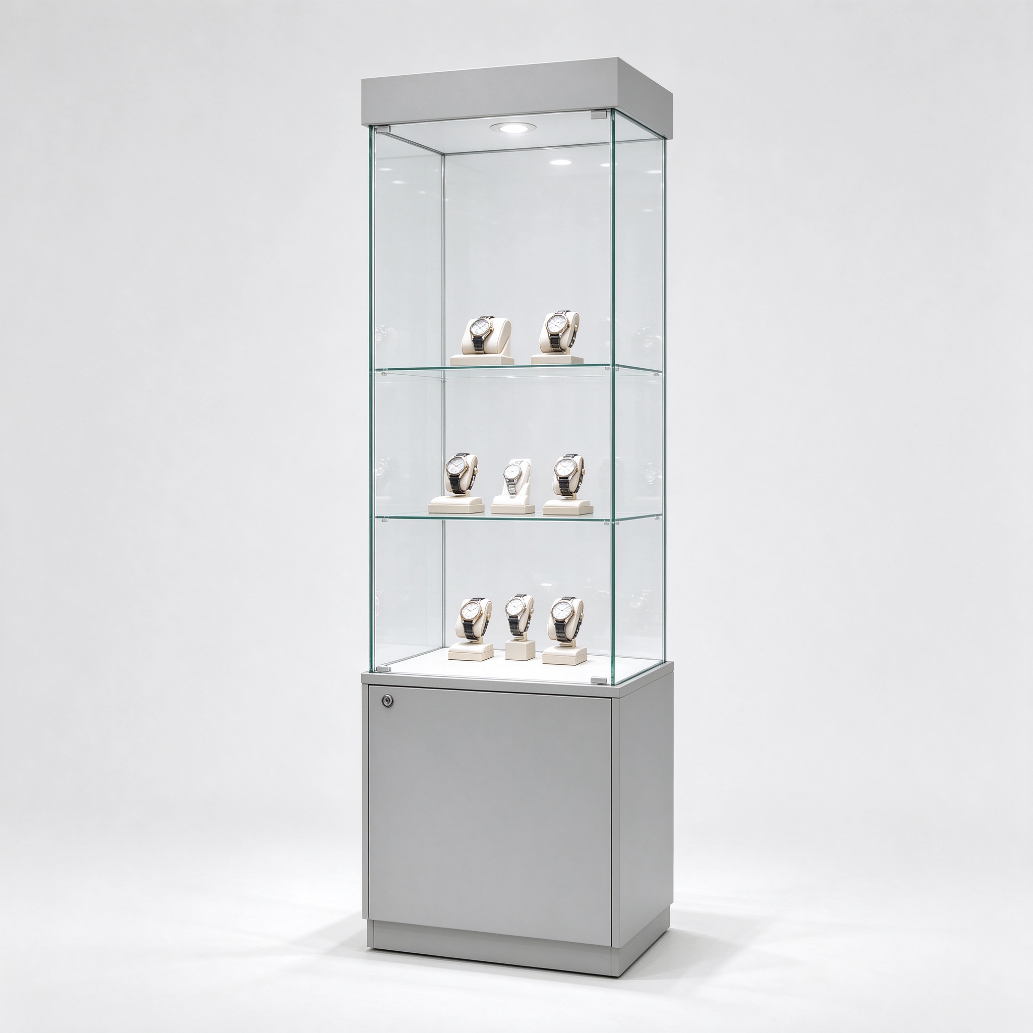 Light gray glass watch display tower cabinet with lockable base, left 45 degree view