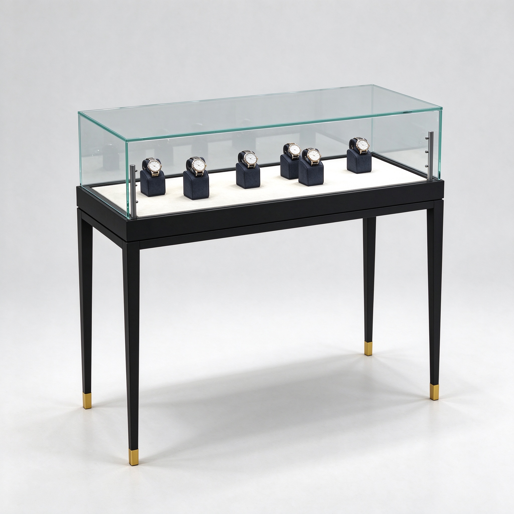 Black slim-leg glass watch display table with gold ferrules, left 45 degree view