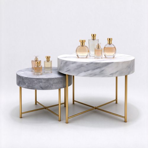 Set of 2 nesting marble perfume display tables left 45 degree view