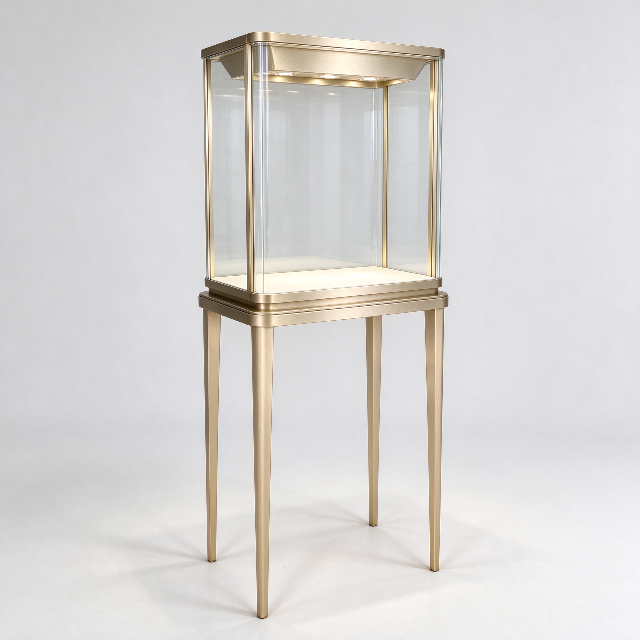 Illuminated champagne gold tall-leg glass case left 45 degree view