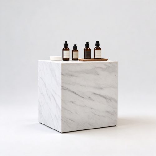 White Carrara marble cube perfume display pedestal left 45 degree view