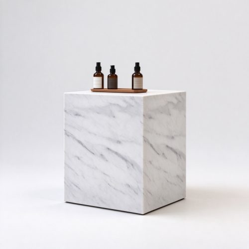 White Carrara marble cube perfume display pedestal right 45 degree angle view