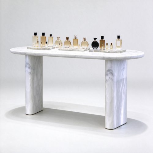 Solid white veined marble perfume display table with perfume bottles right 45 degree angle view