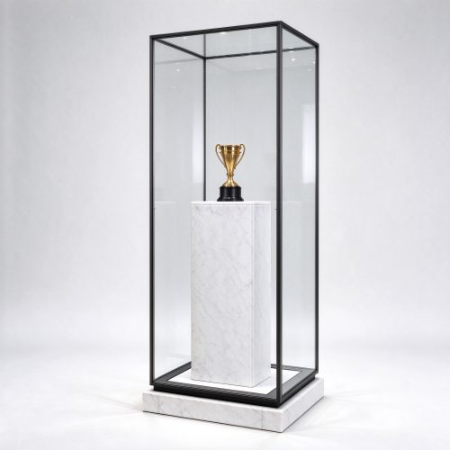 Pedestal trophy display case with single trophy on clean marble column, right 45 degree view